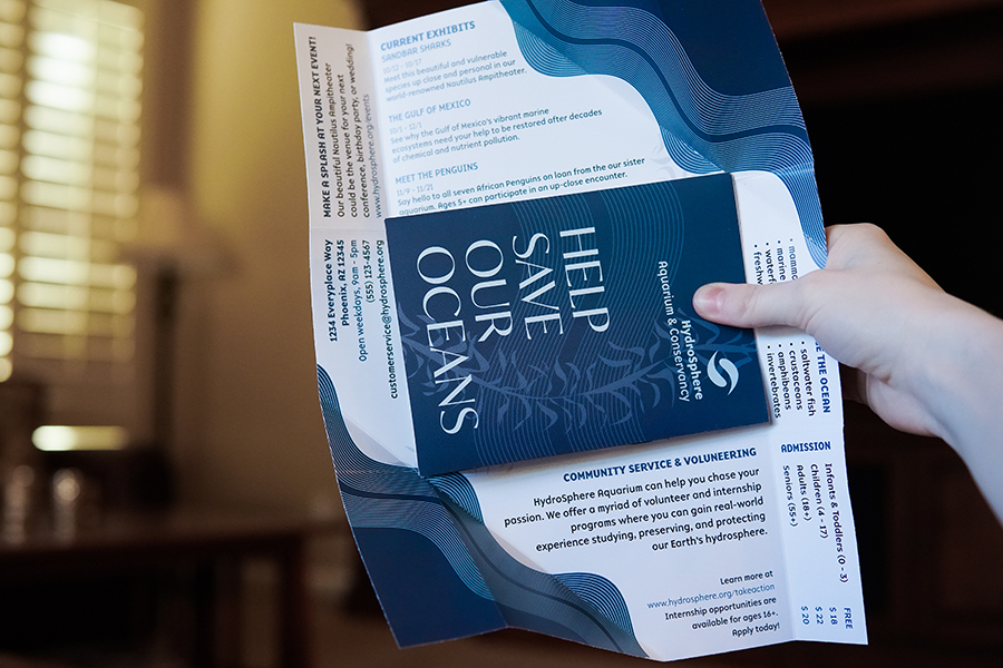 the hydrosphere aquarium flyer/envelope hybrid opened fully with the brochure inside